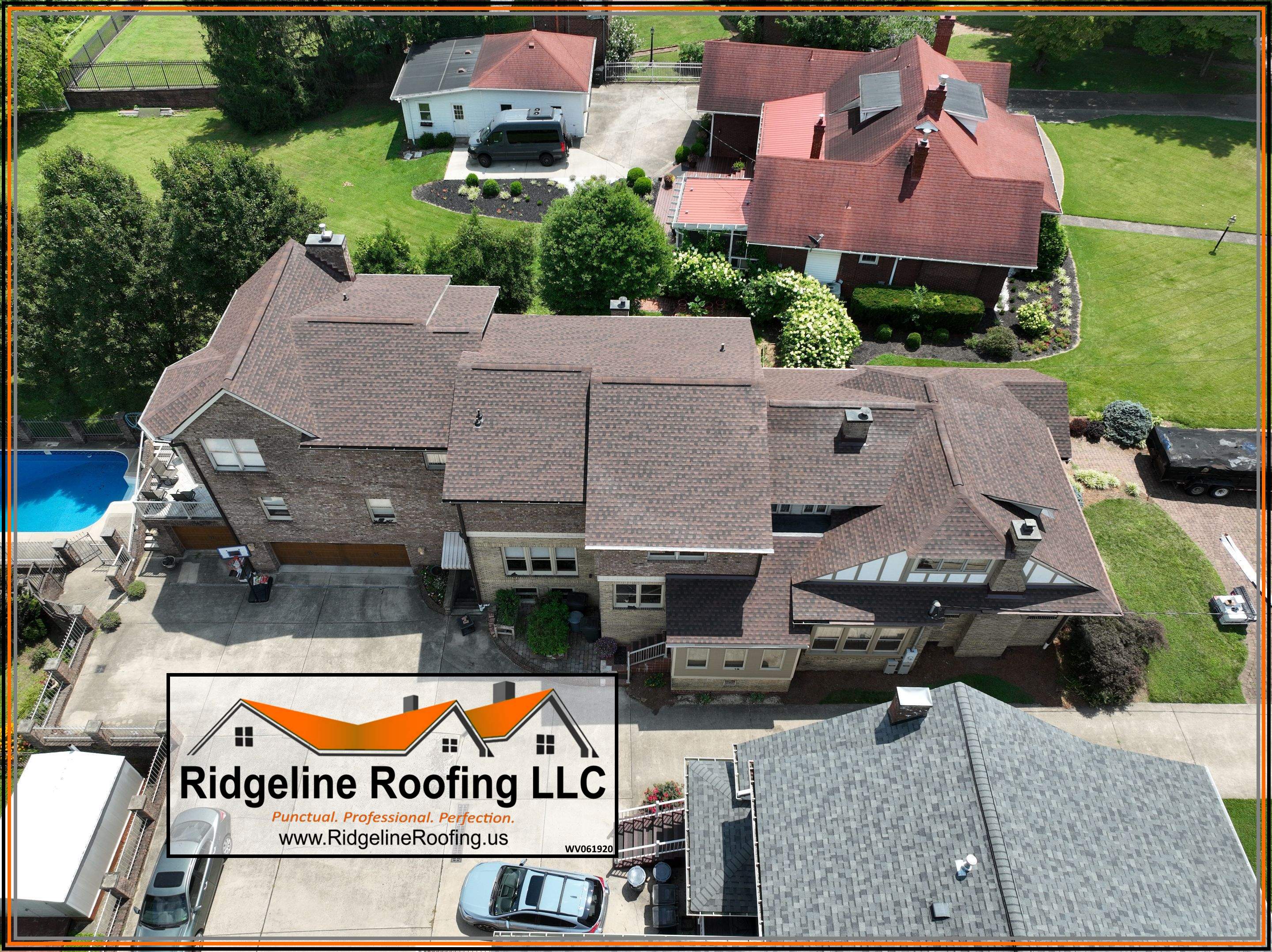 Brown shingle roof on a brick and stone estate with pool